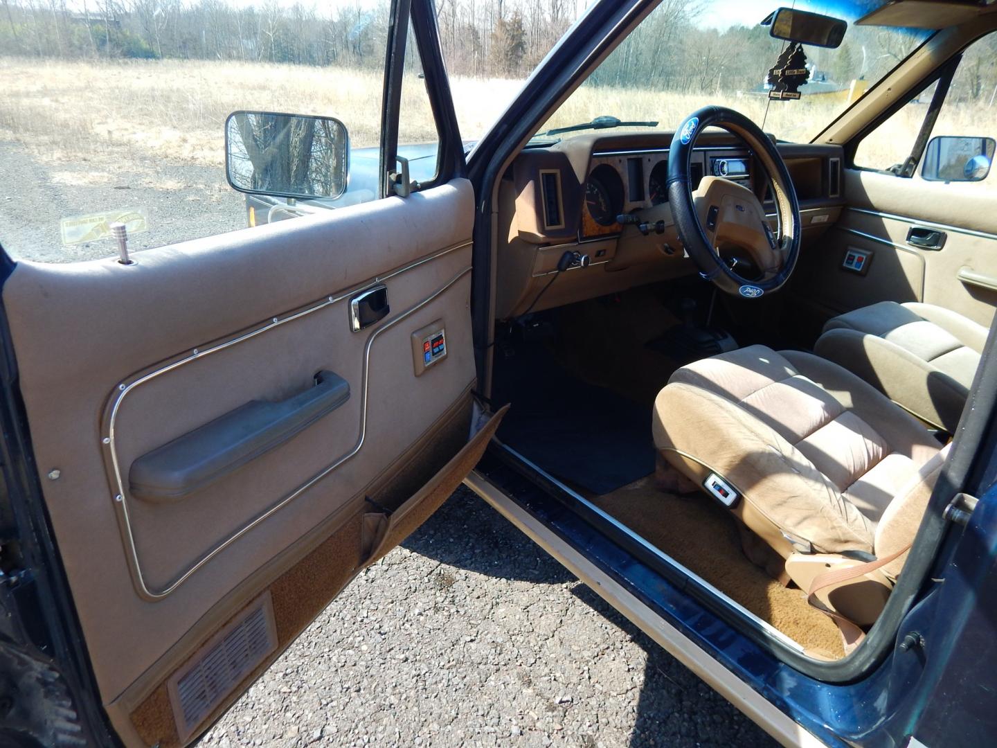 1988 Blue /Tan Ford Bronco II 4WD (1FMCU14T6JU) with an 2.9L V6 OHV 12V engine, 4-Speed Automatic Overdrive transmission, located at 6528 Lower York Road, New Hope, PA, 18938, (215) 862-9555, 40.358707, -74.977882 - Here we have a 1988 Ford Bronco 2 with a 2.9L V6 putting power to a 4x4 automatic transmission. Options include: tan cloth interior, heat/AC, XD Vision radio, power windows, cruise control, tilt steering wheel, front/rear defrost windows, spare tire cover, 15 inch alloy wheels with 4 Solarus AP tire - Photo#21